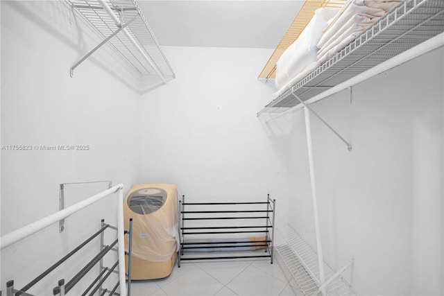 spacious closet with tile patterned floors