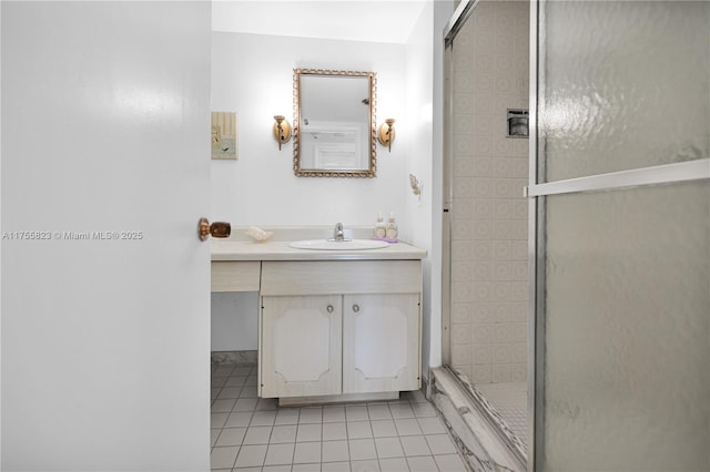 bathroom featuring a stall shower, tile patterned flooring, and vanity