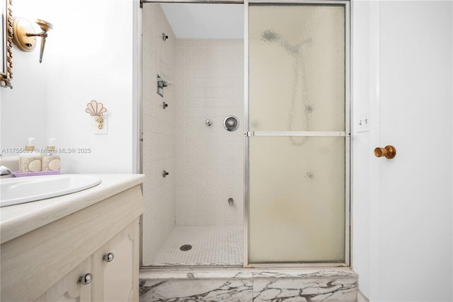 full bathroom featuring a stall shower and vanity