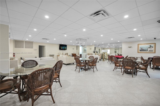 dining area with a paneled ceiling, visible vents, recessed lighting, and light tile patterned flooring