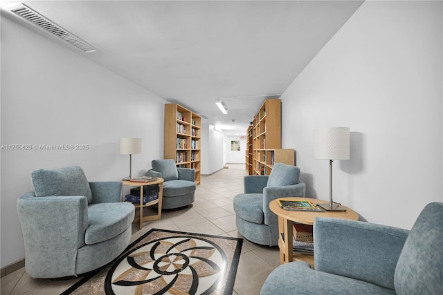 living room with visible vents and tile patterned floors