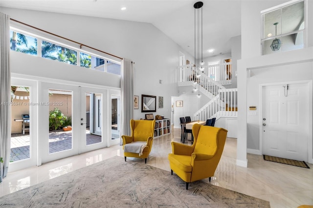 living area with stairs, french doors, recessed lighting, high vaulted ceiling, and tile patterned floors