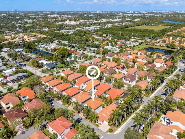 bird's eye view with a water view and a residential view