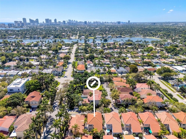 aerial view with a water view and a view of city