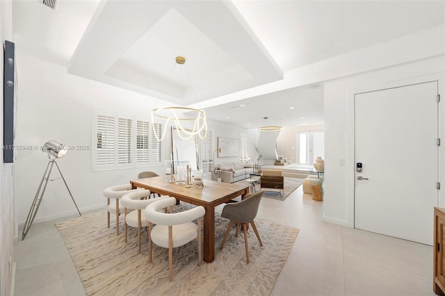 dining area featuring recessed lighting, a raised ceiling, baseboards, and light tile patterned floors