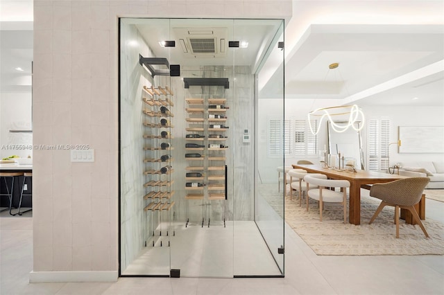 wine area with tile patterned flooring and tile walls