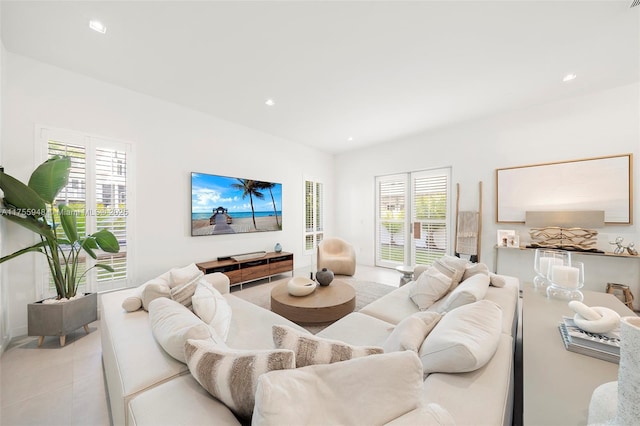 living area with recessed lighting and tile patterned floors