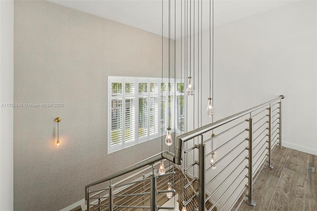 interior space featuring baseboards and wood finished floors