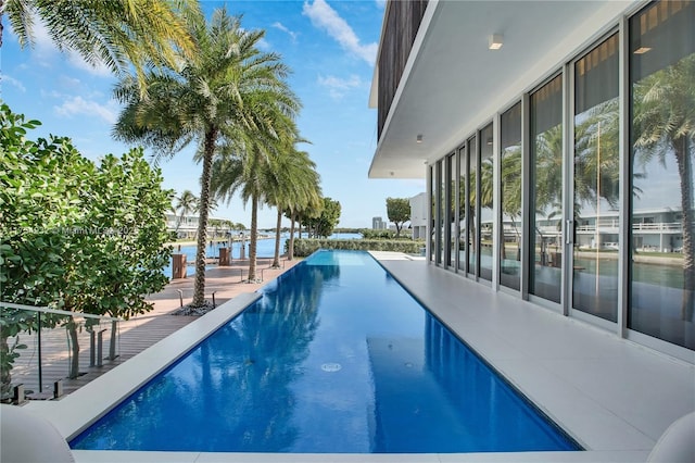 outdoor pool with a water view