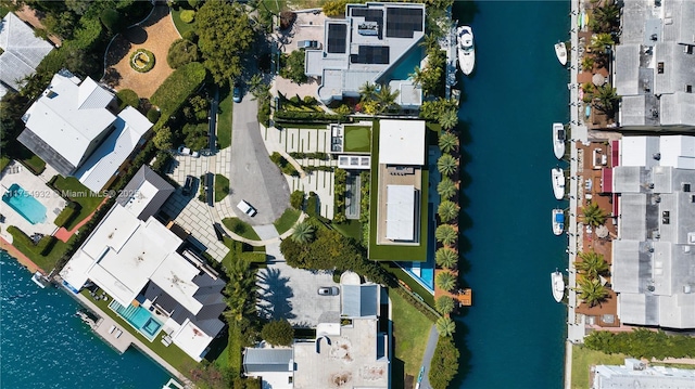 drone / aerial view featuring a water view and a residential view