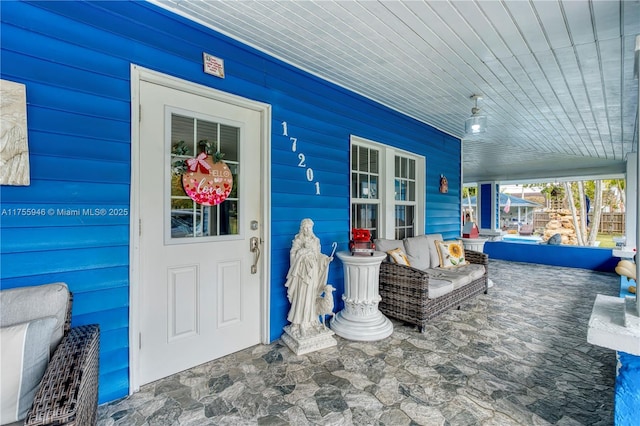 doorway to property featuring covered porch