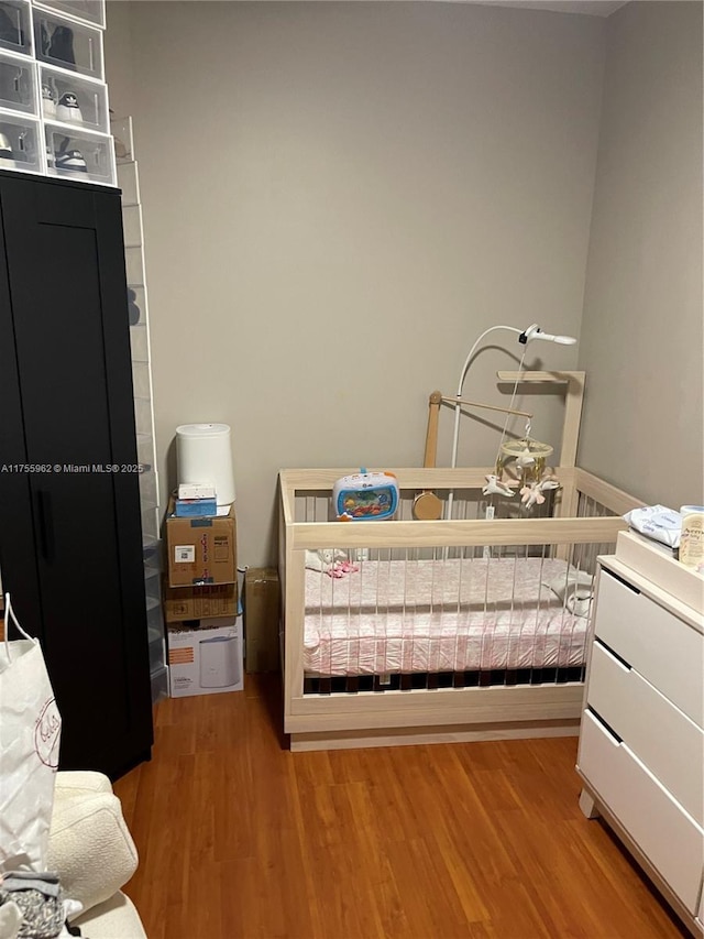 bedroom featuring wood finished floors