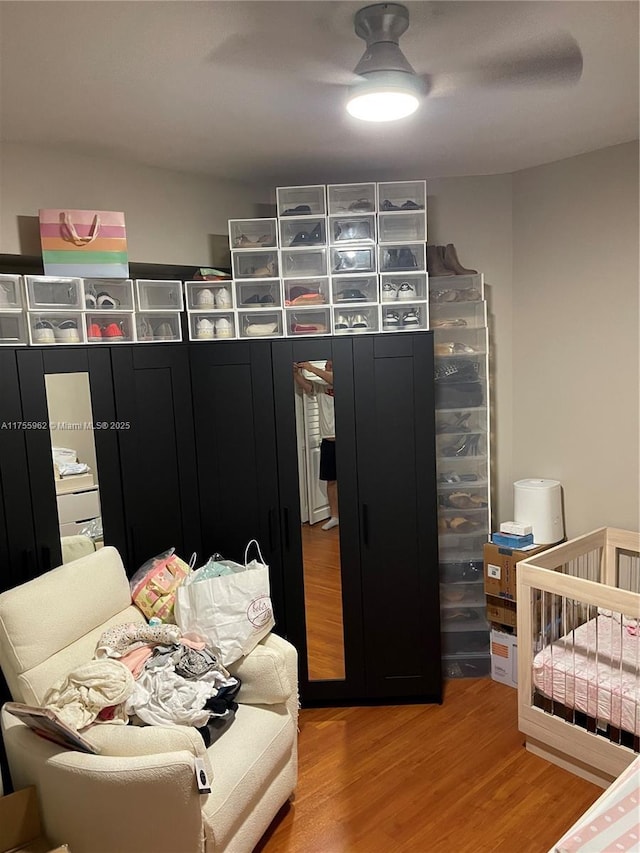 bedroom featuring a ceiling fan and wood finished floors