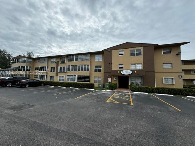 view of property with uncovered parking