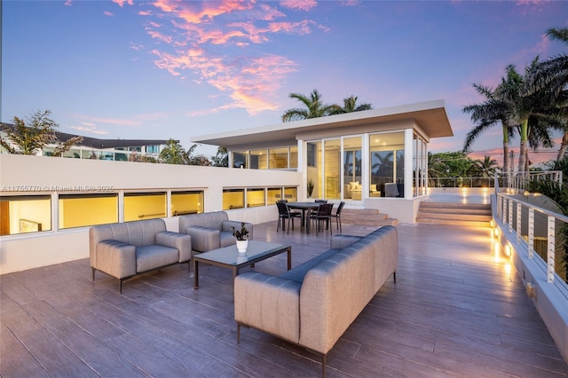 patio terrace at dusk with an outdoor hangout area