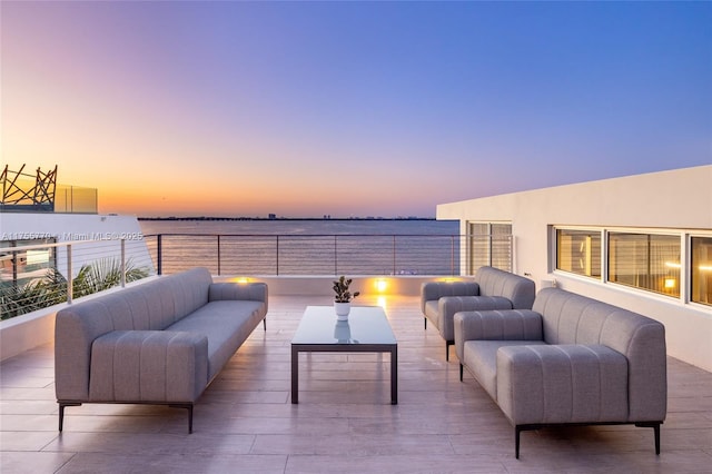 patio terrace at dusk with an outdoor living space