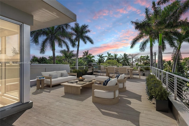 wooden terrace featuring an outdoor hangout area and area for grilling