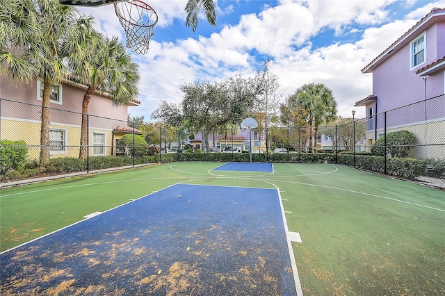 view of basketball court featuring community basketball court and fence