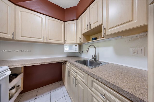 kitchen with open shelves, light tile patterned floors, light countertops, and a sink