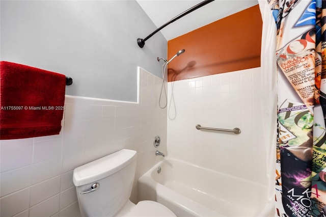 full bathroom with toilet, tile walls, and shower / bathtub combination with curtain