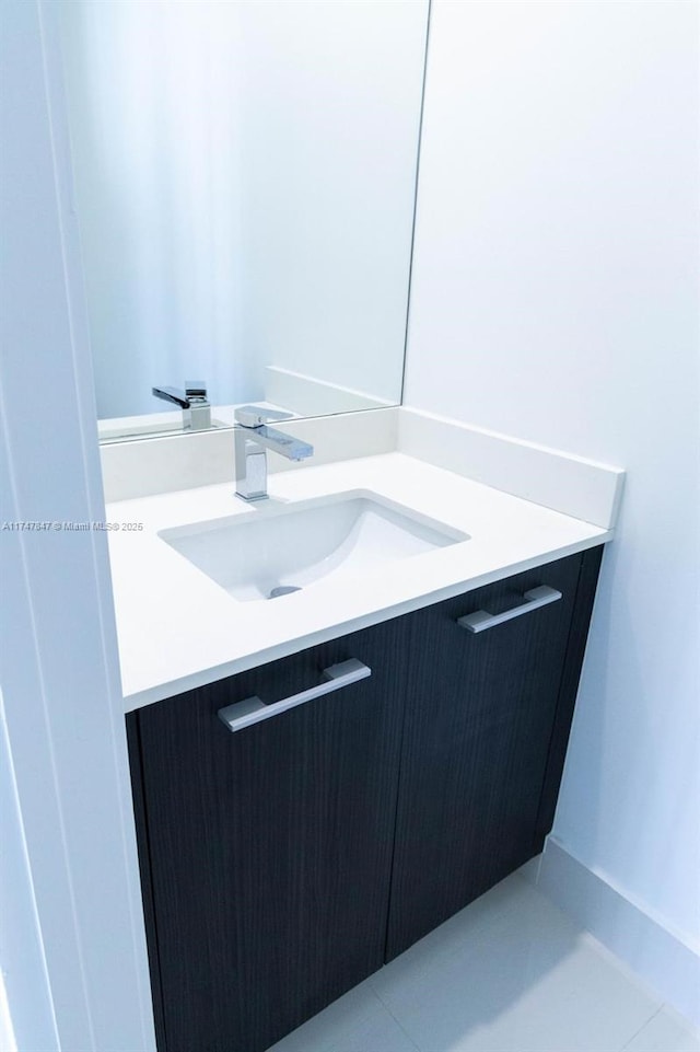 bathroom featuring tile patterned flooring and vanity