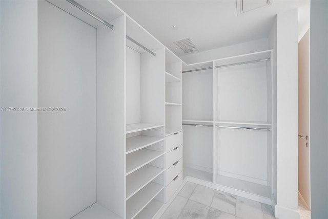 walk in closet with visible vents