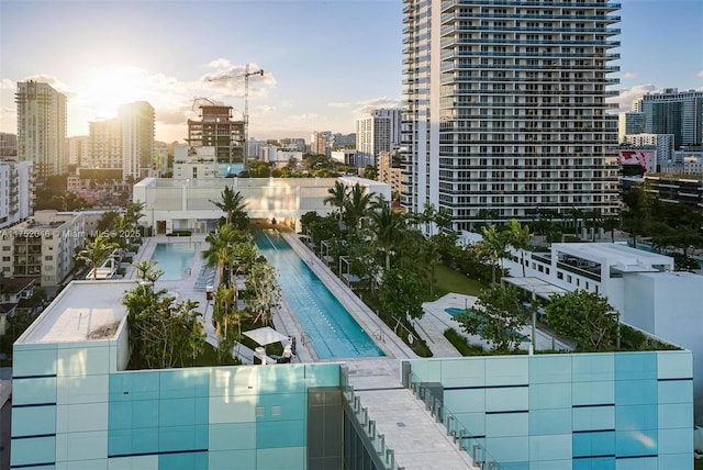 view of swimming pool with a city view