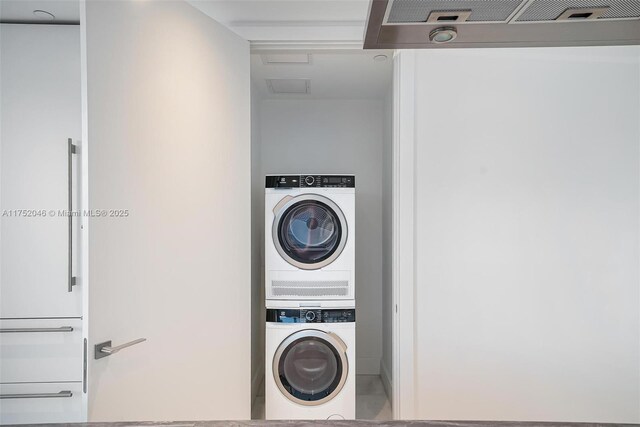 700 NE 26th Ter Unit 1105, Miami, FL 33137 - washroom featuring estacked washer and dryer and attic access