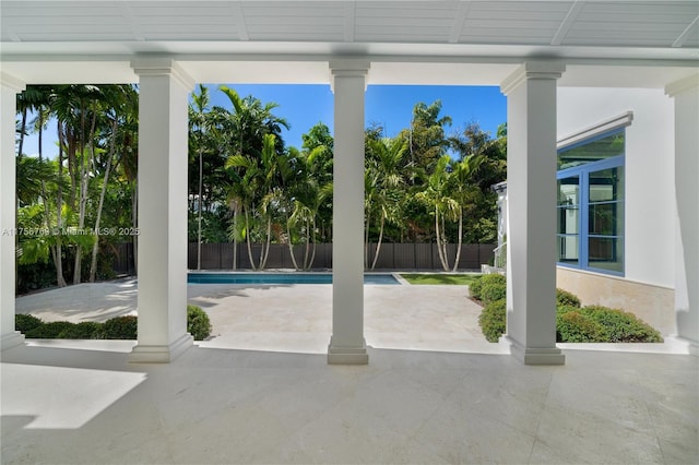 view of swimming pool featuring a patio area, fence, and a fenced in pool