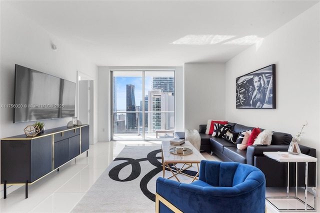 living area with a view of city, a wall of windows, and tile patterned floors