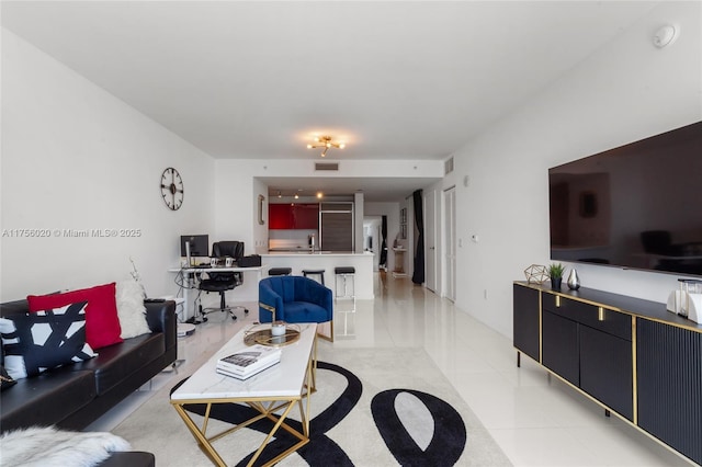 living room with visible vents and light tile patterned floors