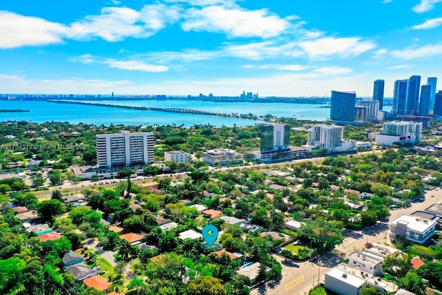 aerial view featuring a view of city and a water view