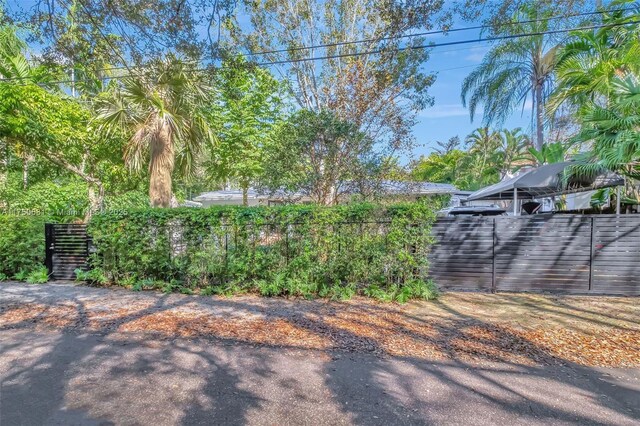 view of gate with fence