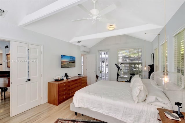 bedroom featuring visible vents, lofted ceiling with beams, light wood-style flooring, ceiling fan, and a wall mounted air conditioner