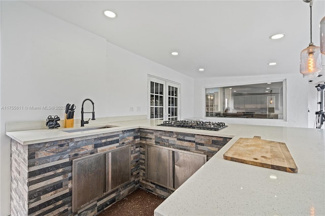 kitchen featuring gas cooktop, recessed lighting, a sink, french doors, and decorative light fixtures