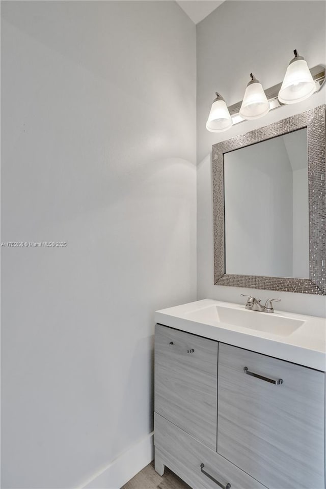 bathroom featuring baseboards and vanity