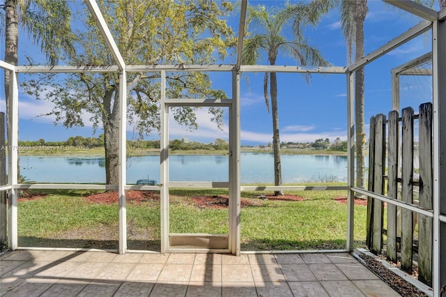 unfurnished sunroom with a water view