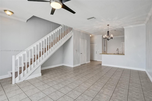 unfurnished living room featuring ceiling fan with notable chandelier, a sink, baseboards, stairway, and crown molding