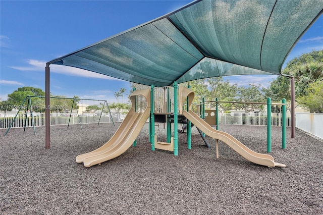 communal playground featuring fence