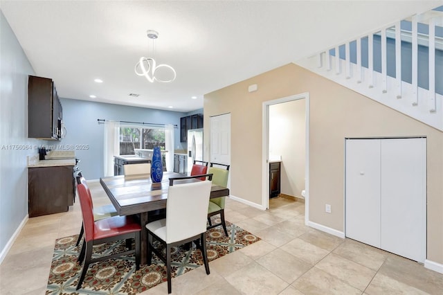 dining room featuring light tile patterned floors, baseboards, a notable chandelier, and recessed lighting