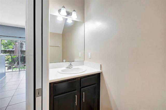 bathroom featuring tile patterned flooring and vanity