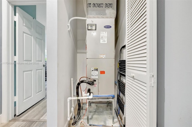 utility room featuring heating unit