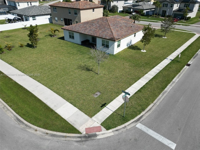 birds eye view of property with a residential view