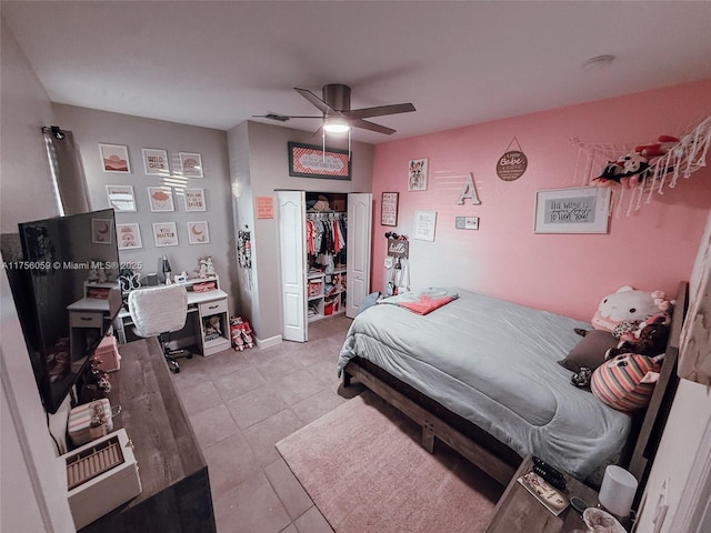 bedroom featuring ceiling fan, a closet, light tile patterned flooring, and visible vents