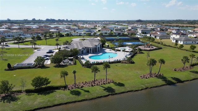 bird's eye view with a water view and a residential view