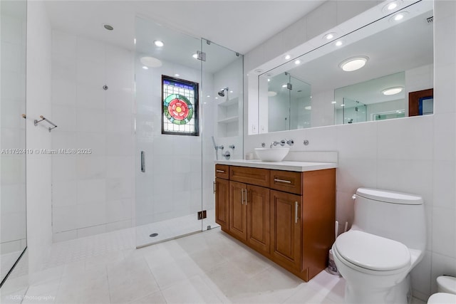 bathroom featuring toilet, a shower stall, tile walls, and vanity