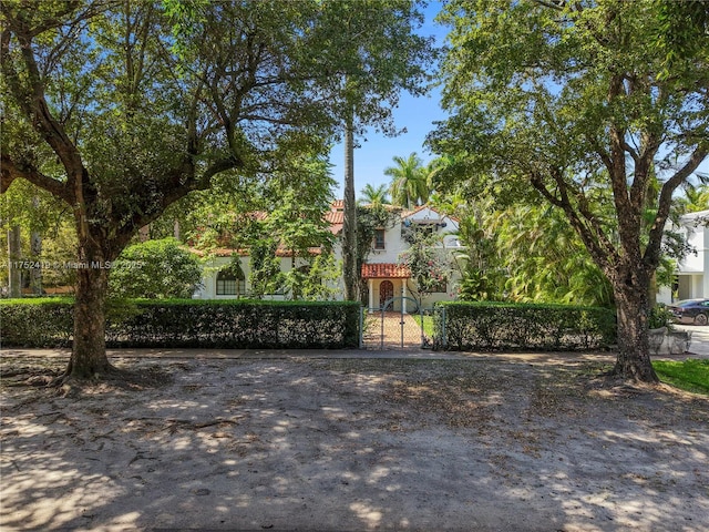 1624 Granada Blvd, Coral Gables, FL 33134 - view of front of house with a gate and stucco siding