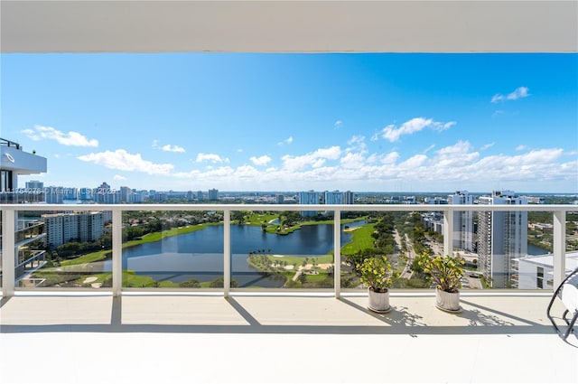 balcony featuring a view of city and a water view