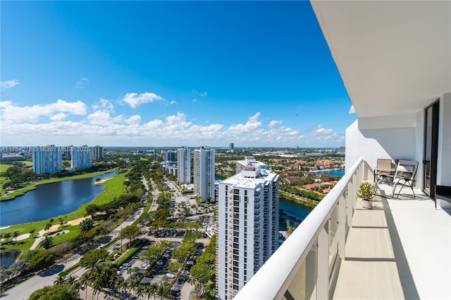 balcony with a view of city and a water view