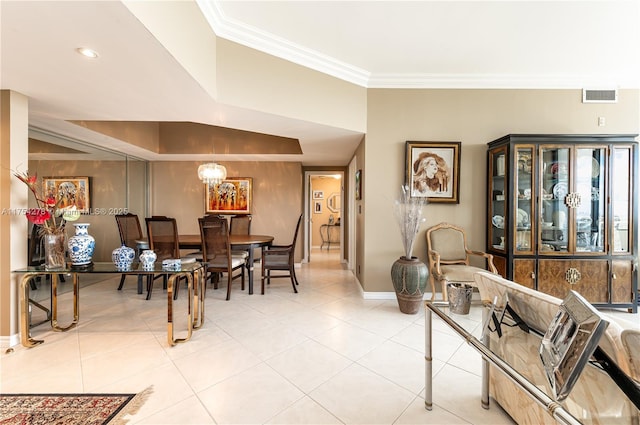 dining room featuring light tile patterned floors, baseboards, visible vents, and crown molding